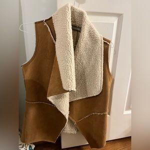 Cutest Sherpa vest. Perfect for winter and way to elevate any outfit!